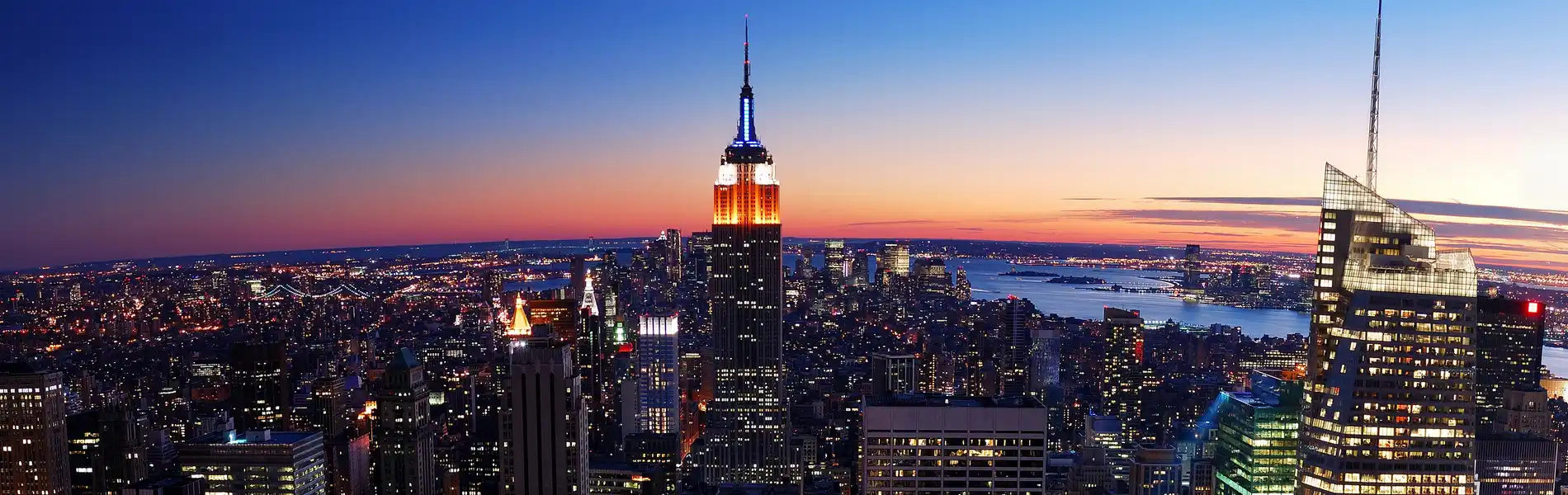Neon color image of a band playing and people singing along