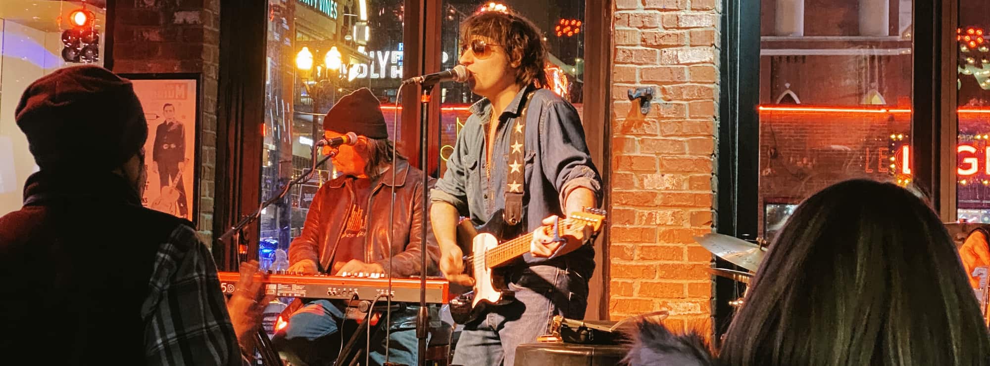 bar singer on guitar in New York City